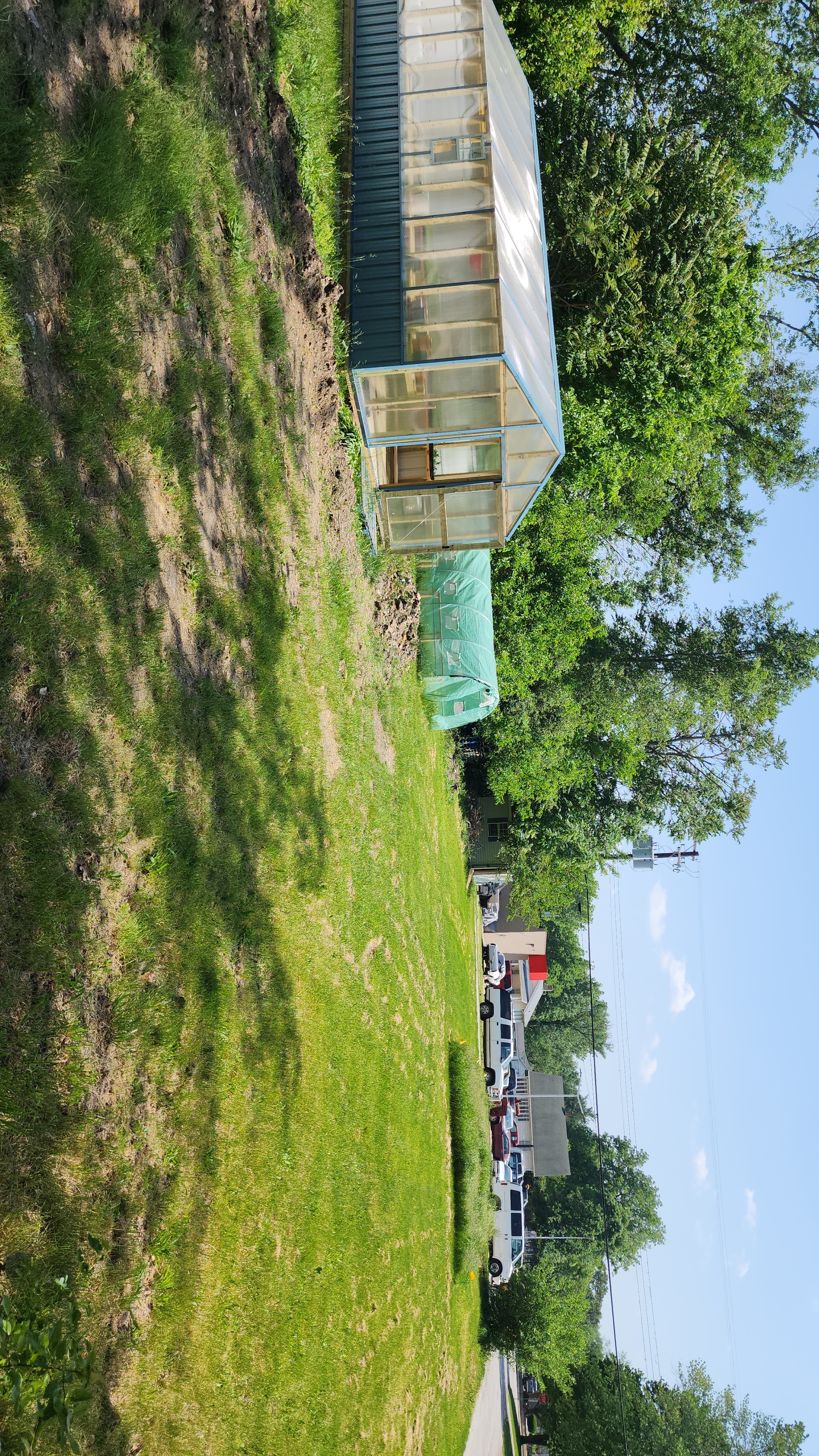 Baxter Gardens greenhouse interior with work benches and natural light