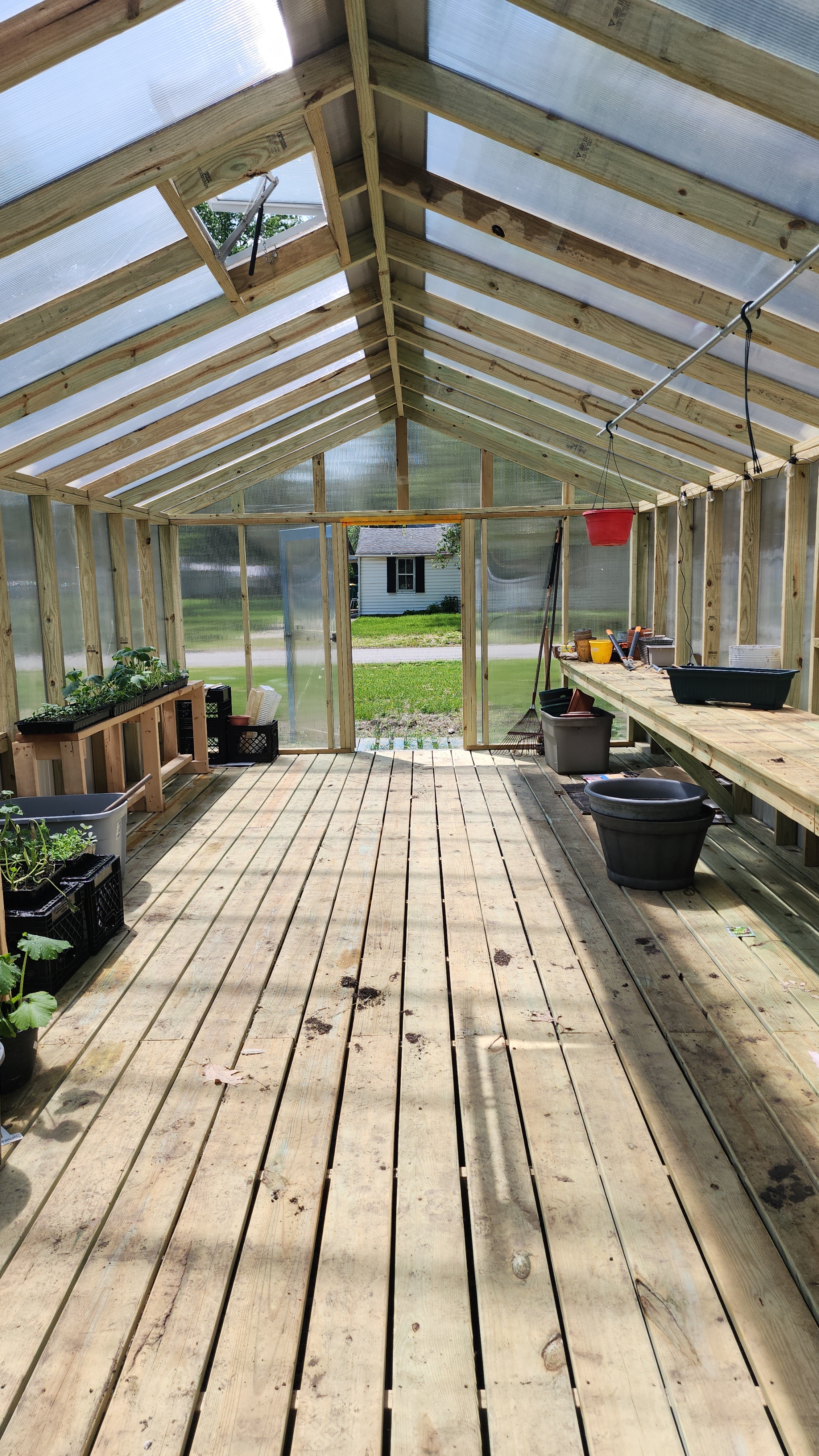 Baxter Gardens aerial overview with greenhouse and hoop house